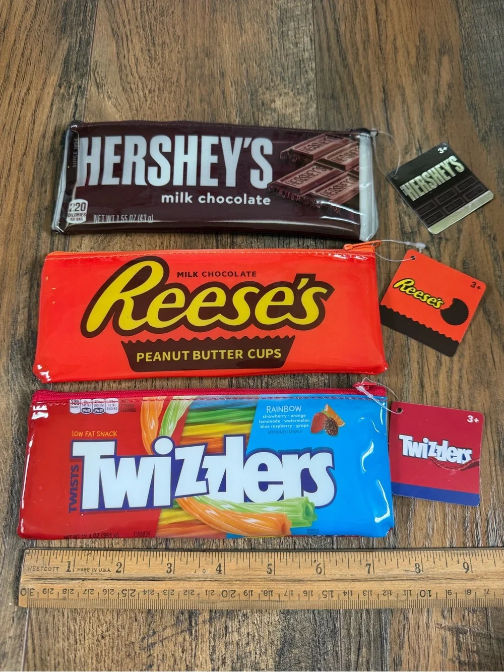 NWT Candy bar logo zipper pouches